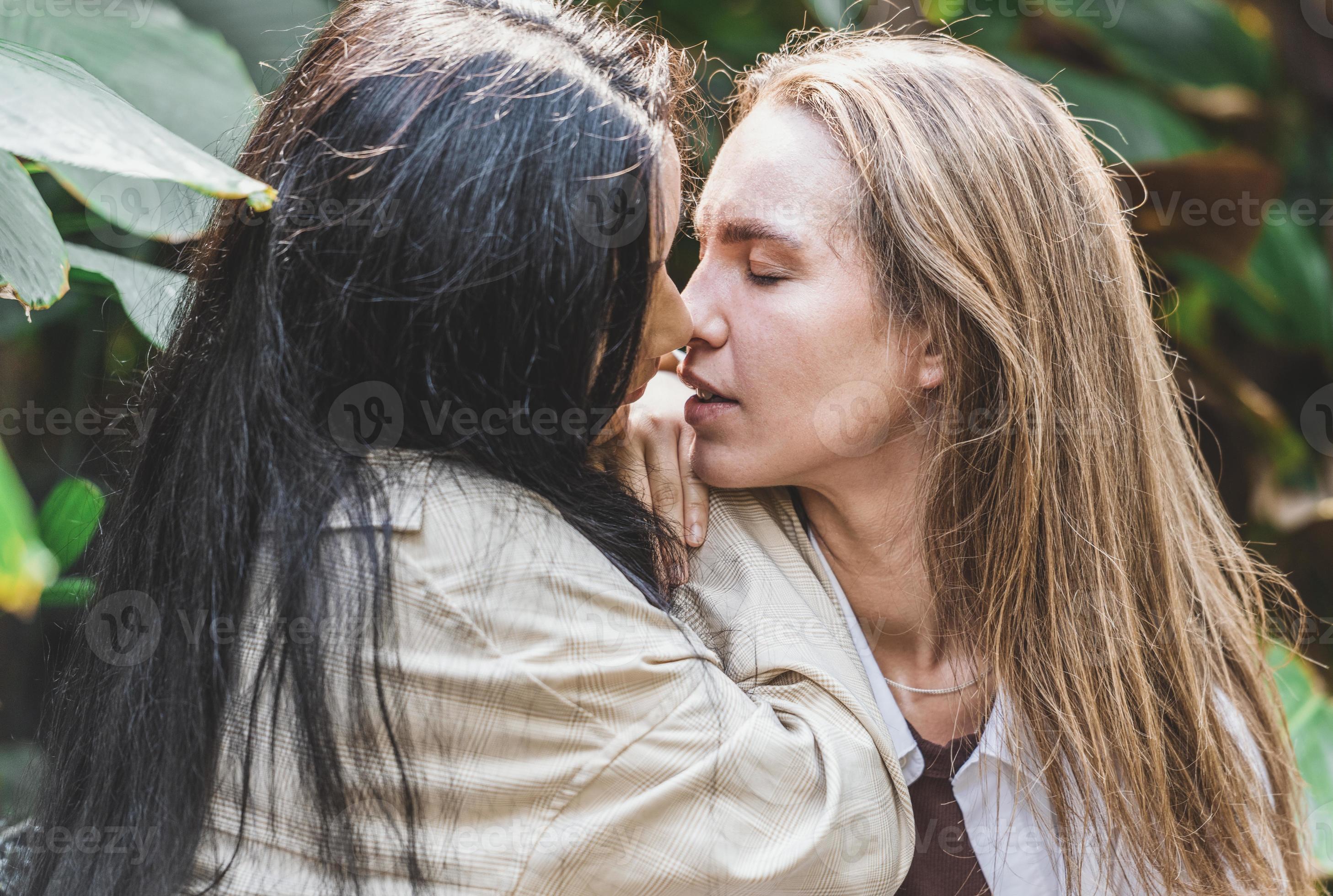 A couple of gay woman smiling and kissing