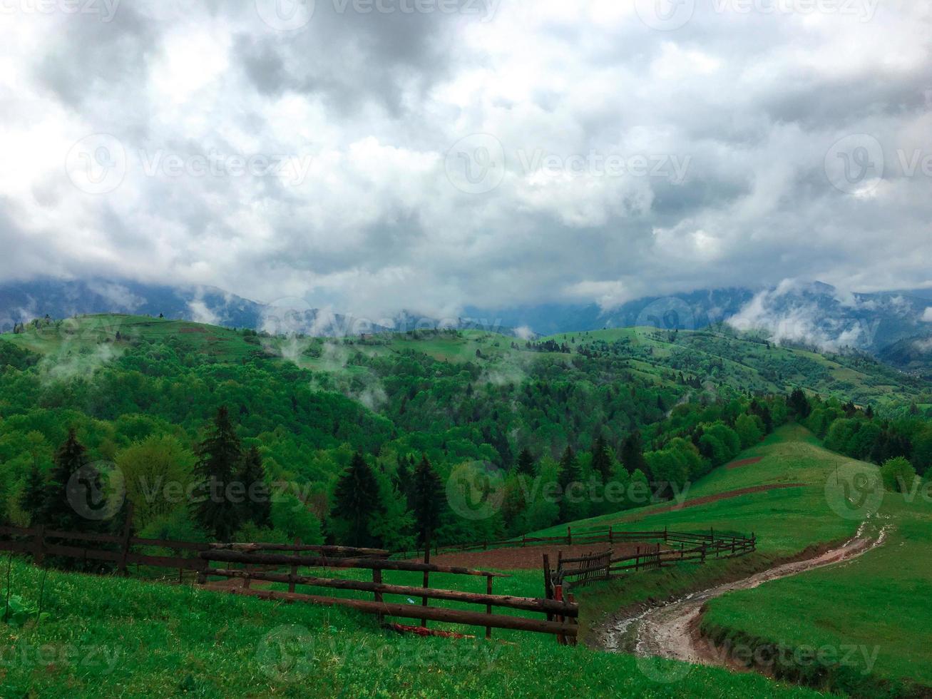 clouds rise up straight from the mountains photo