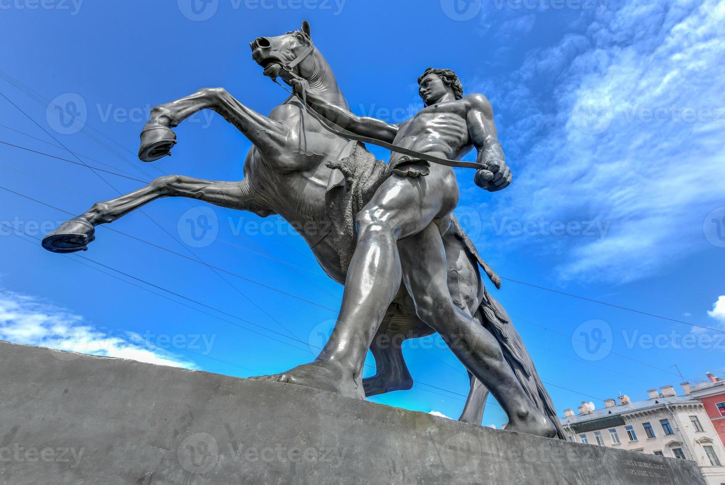 Horse Tamer sculpture of the 19th century on the Anichkov Bridge in St. Petersburg Attraction, Russia. photo