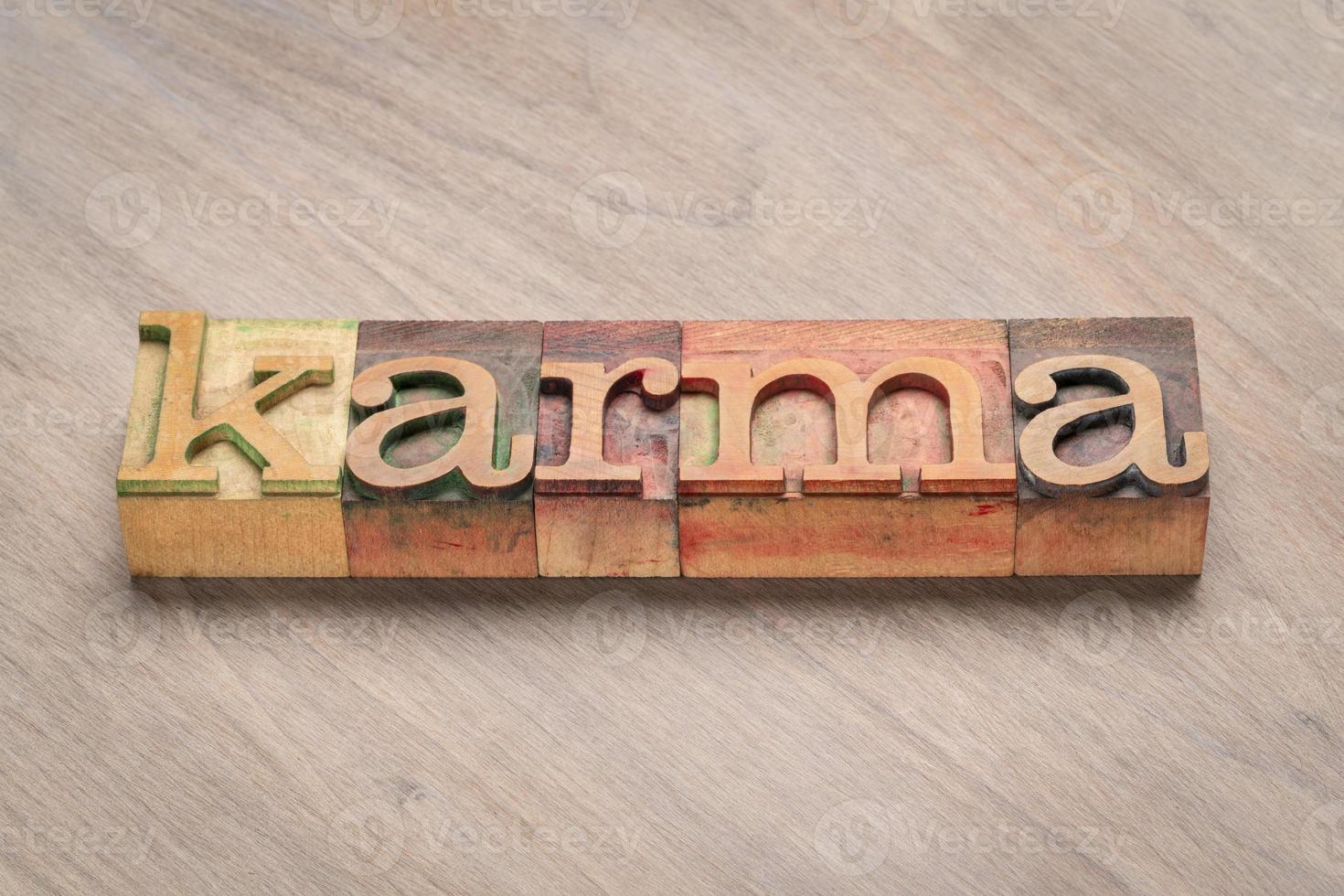 karma word in wood type photo