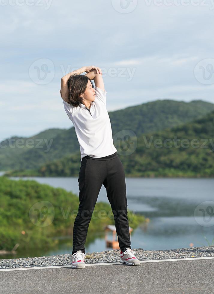 Woman short hair doing exercising outdoor photo
