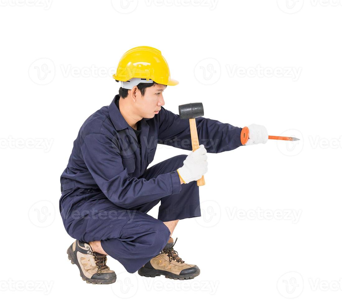 Man hold hammer and cold chisel on white photo