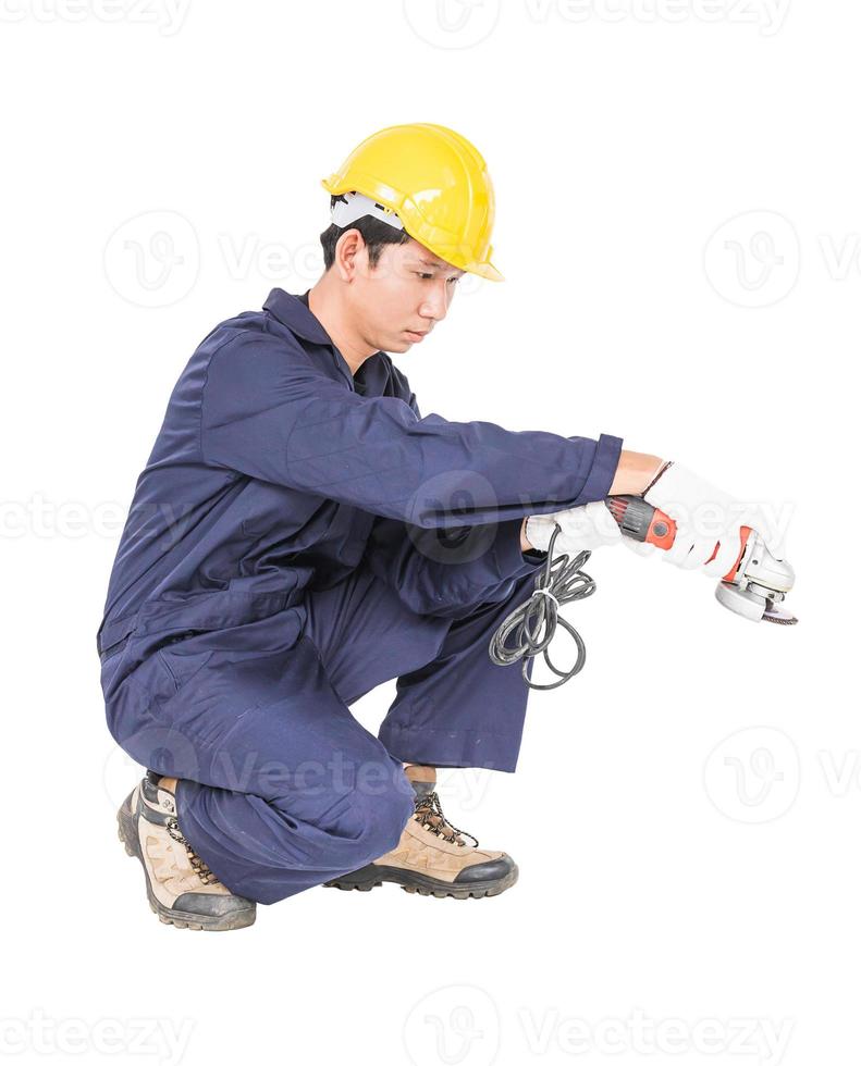 Young handyman in uniform hold grinder photo