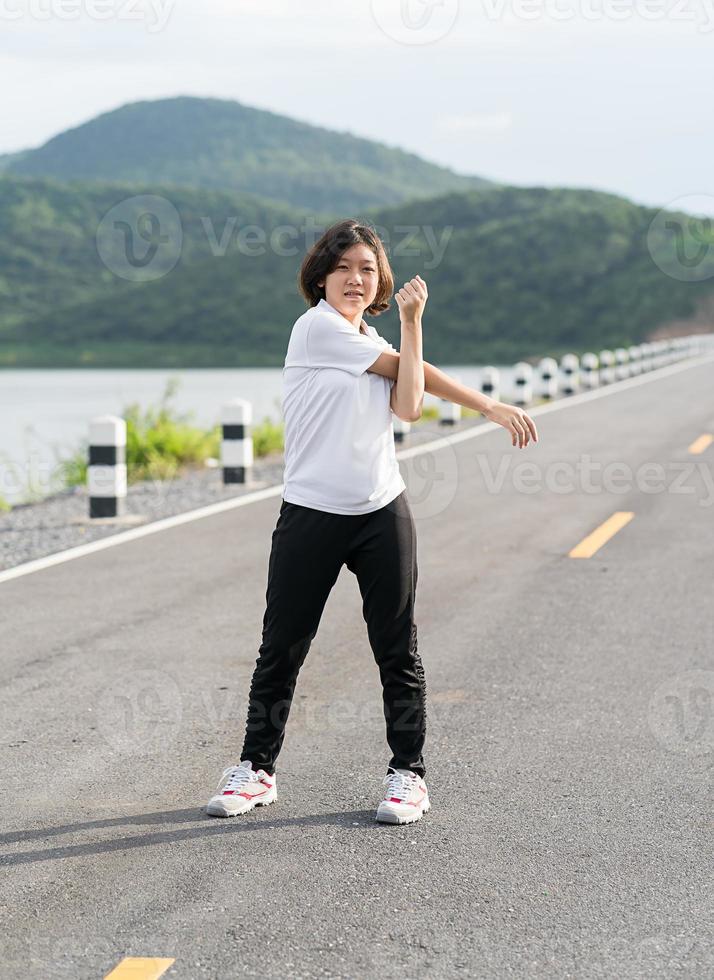 Woman short hair doing exercising outdoor photo