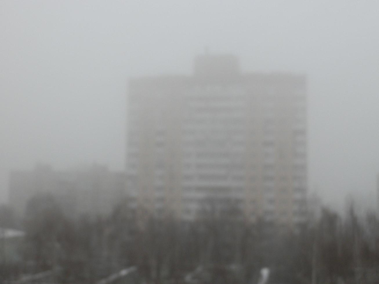 Foggy city with the houses photo