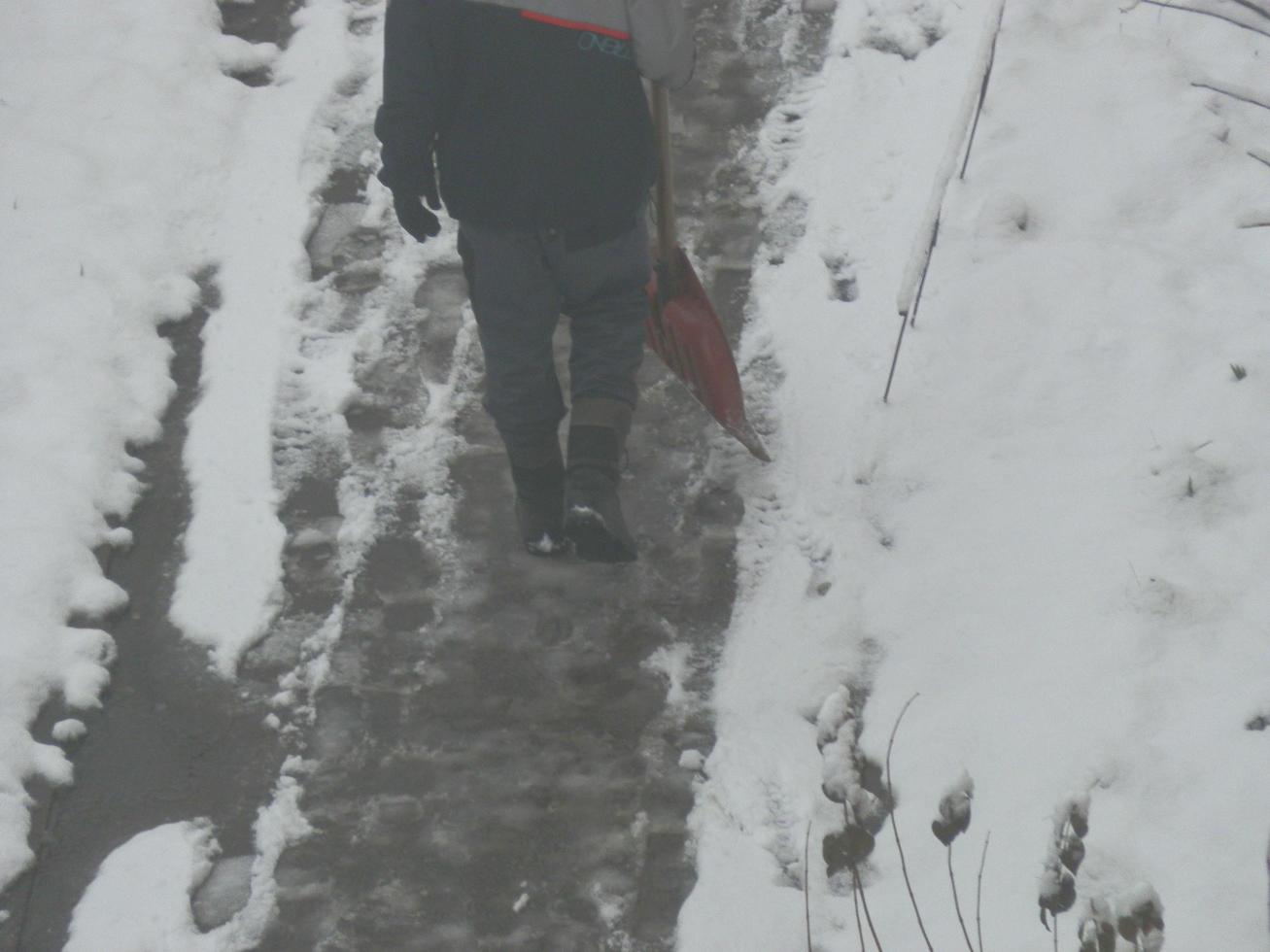 Cleaning the street with snow wipers in winter photo