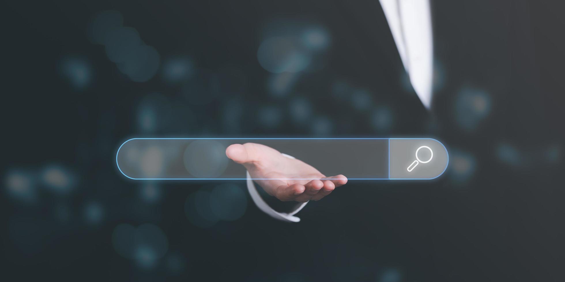 search icon on virtual screen in the hands of marketers,Using Search Console with your website web search concept,information search technology search engine optimization photo