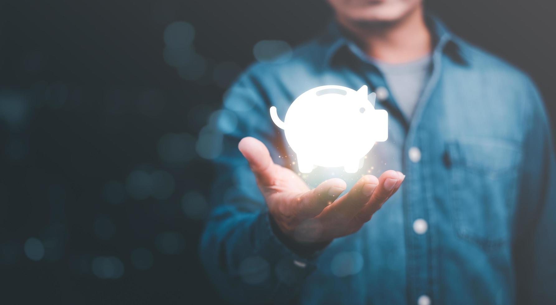 man showing piggy bank icon,Concept of saving money for the future,investment profit growth,planning and managing income and expenses accounts efficiently,retirement money management photo