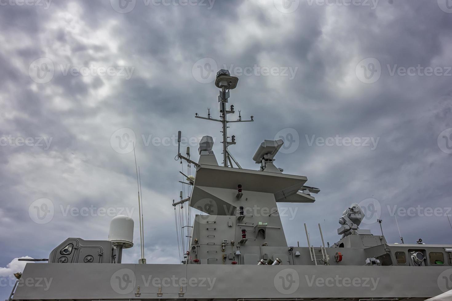 A part of military navy ship. Military sea landscape with cloudy sky photo