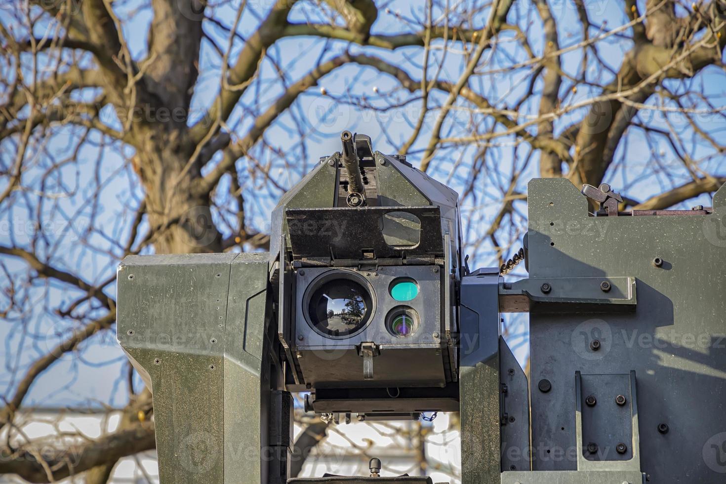 a machine gun with camera and sensors on the roof of the vehicle. Close up photo