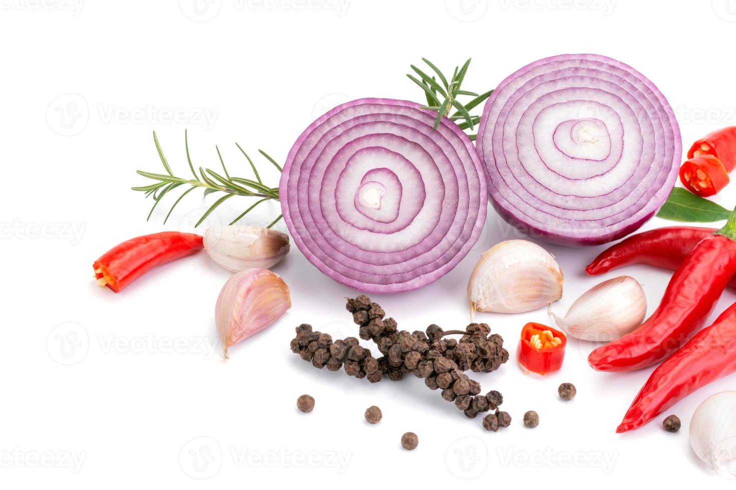 Composition of various herbs and spices vegetables rosemary pepper onion, garlic, fresh red chili, and garden mix for healthy food. isolated on white background, top view photo