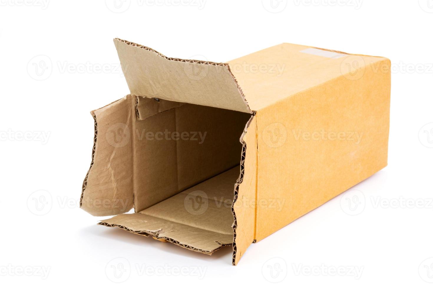 An old cardboard box that has been used. cut or separated on a white background an empty parcel box photo