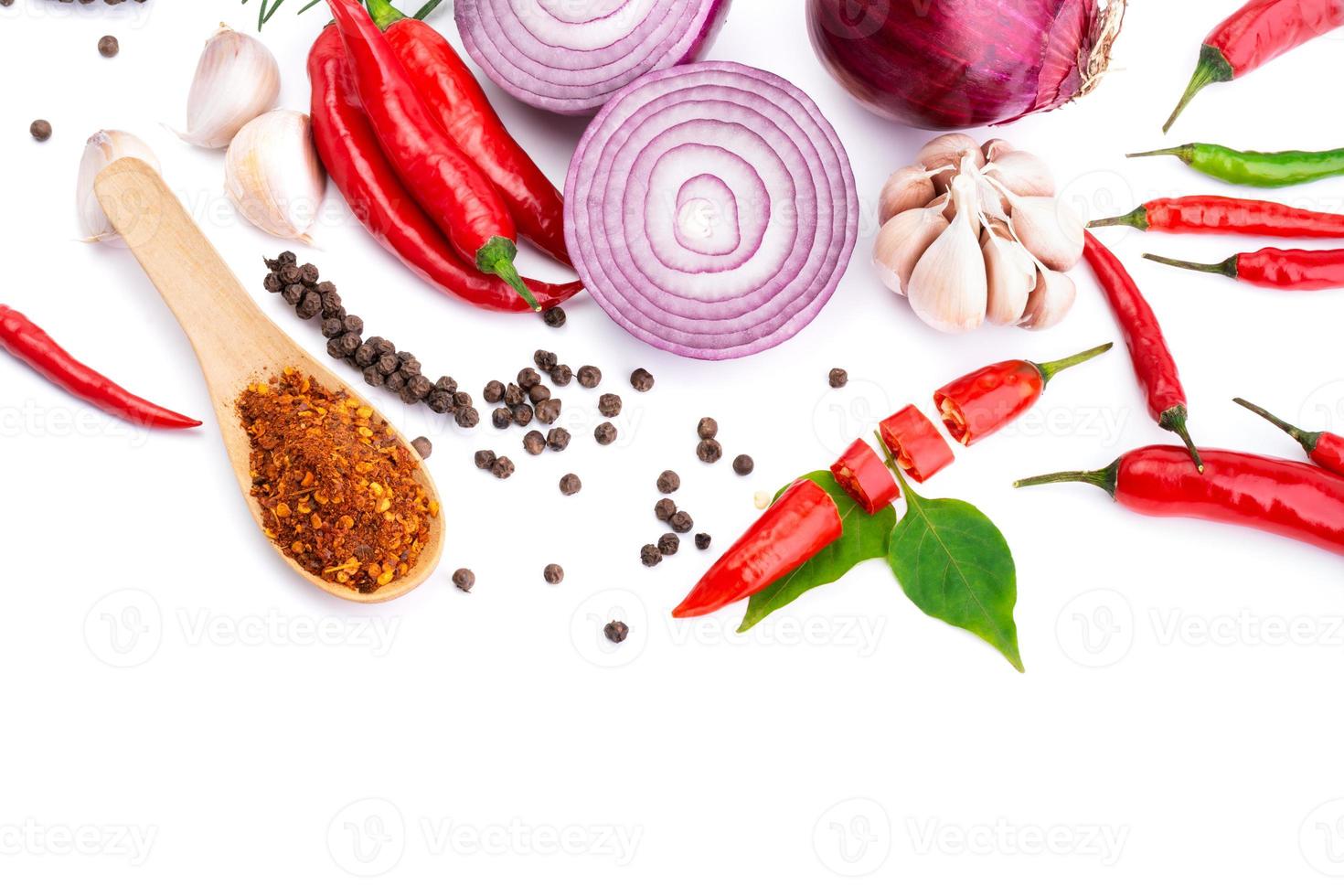 Composition of various herbs and spices vegetables rosemary pepper onion, garlic, fresh red chili, and garden mix for healthy food. isolated on white background, top view photo