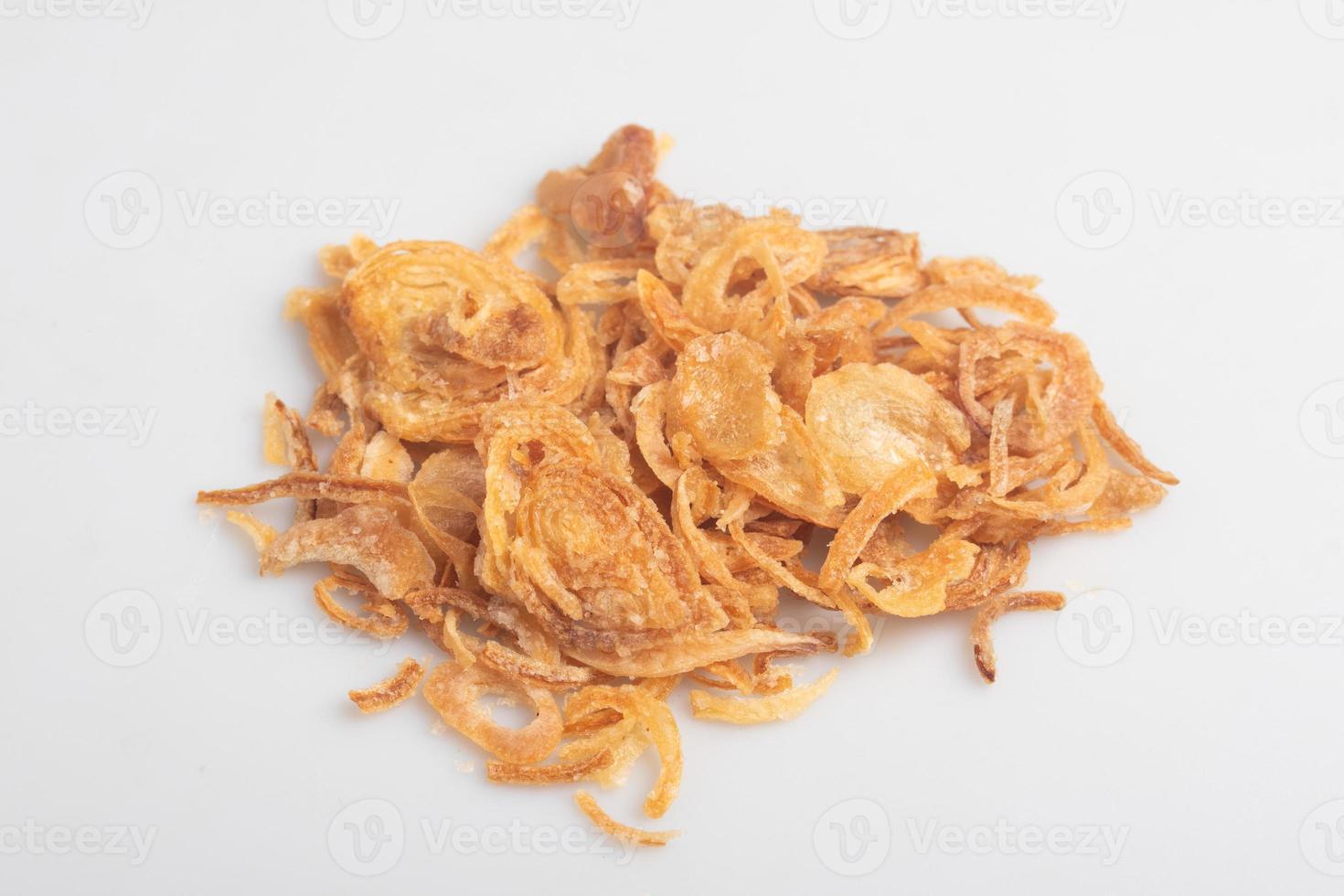 Crispy fried onion slices on a white background photo