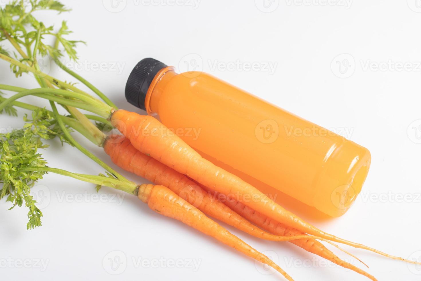 Carrot juice in a clear plastic bottle. Healthy drink. photo