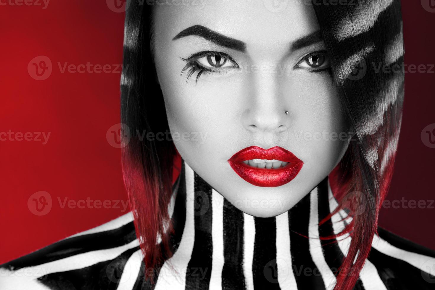 Black and white woman on red background photo