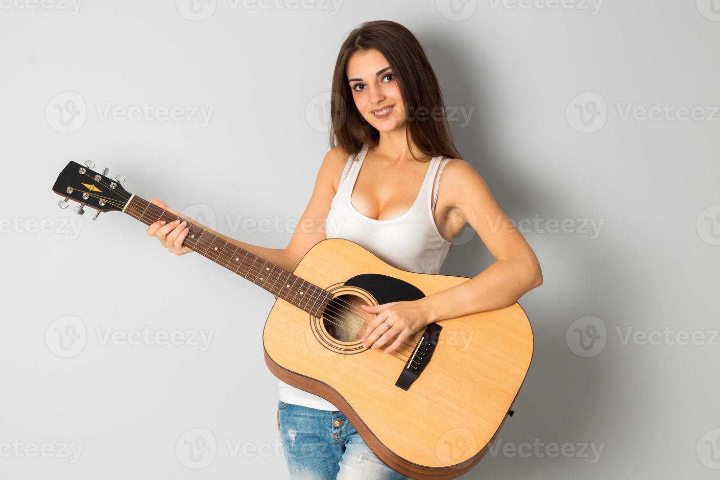 brunette woman with guitar photo