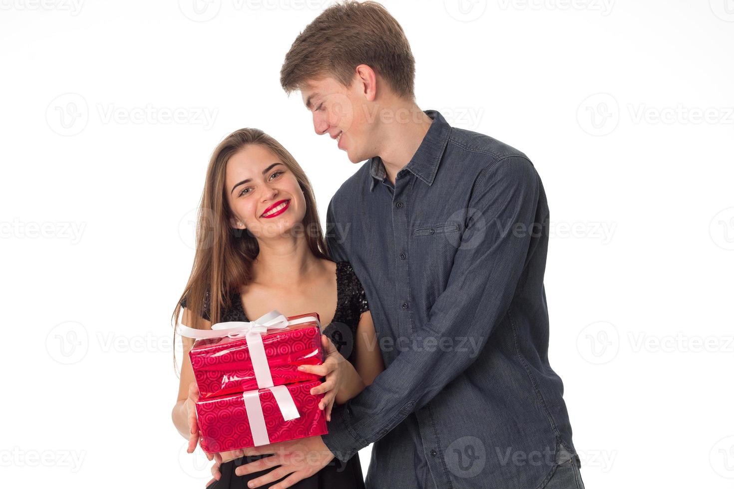 beautiful couple with gift in hands photo