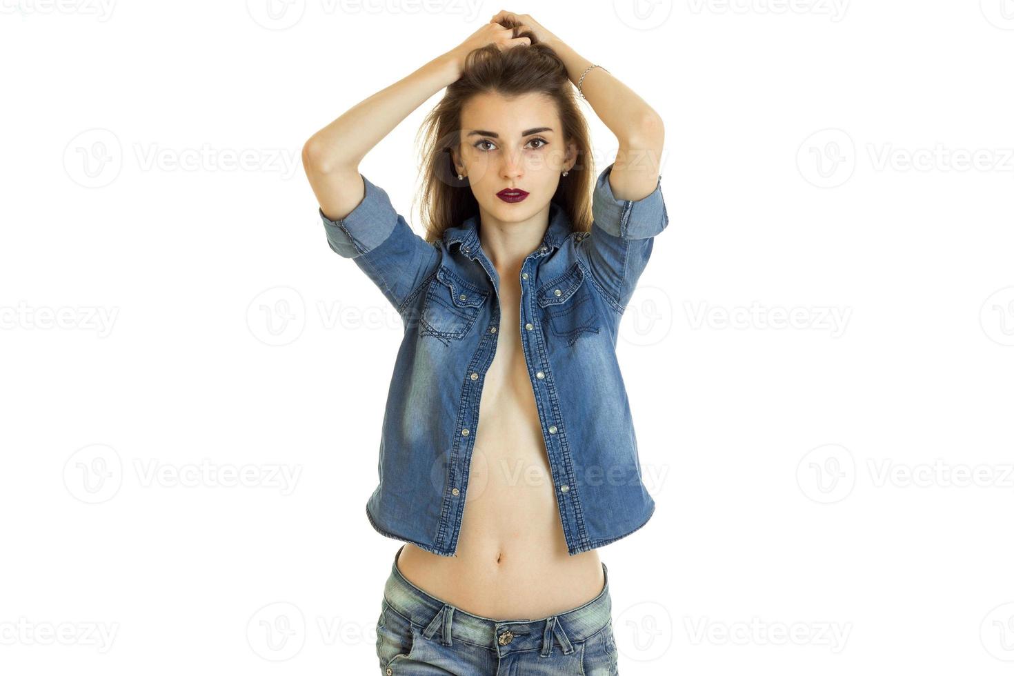 young sensual girl with unbuttoned denim shirt and bare-breasted raised  hands to hair 16037076 Stock Photo at Vecteezy