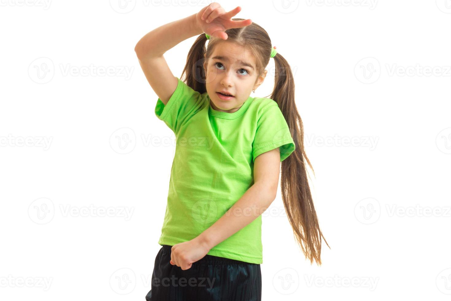 funny little girl in green shirt posing photo