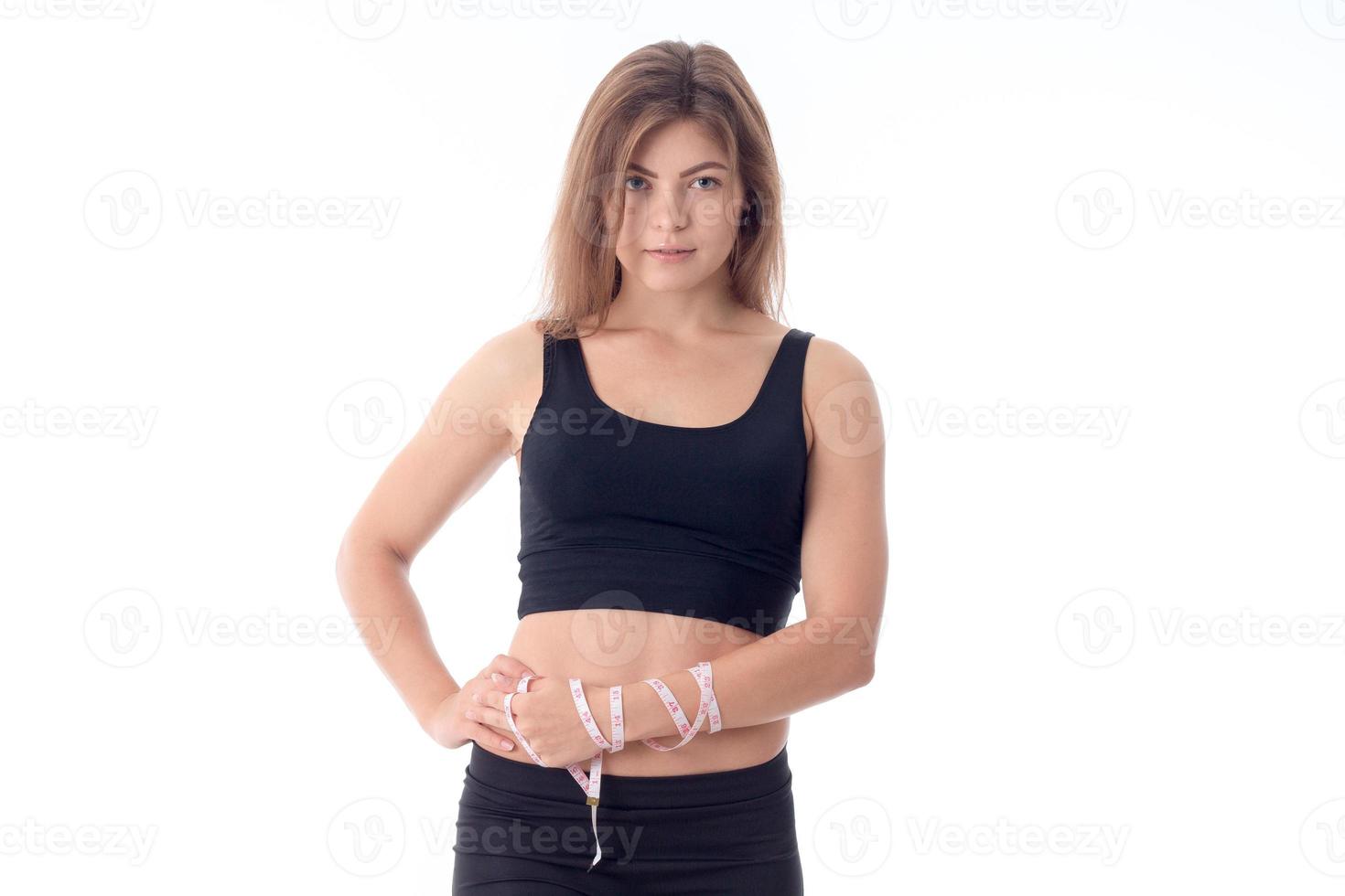 close-up of young athletic girl who is standing sideways photo