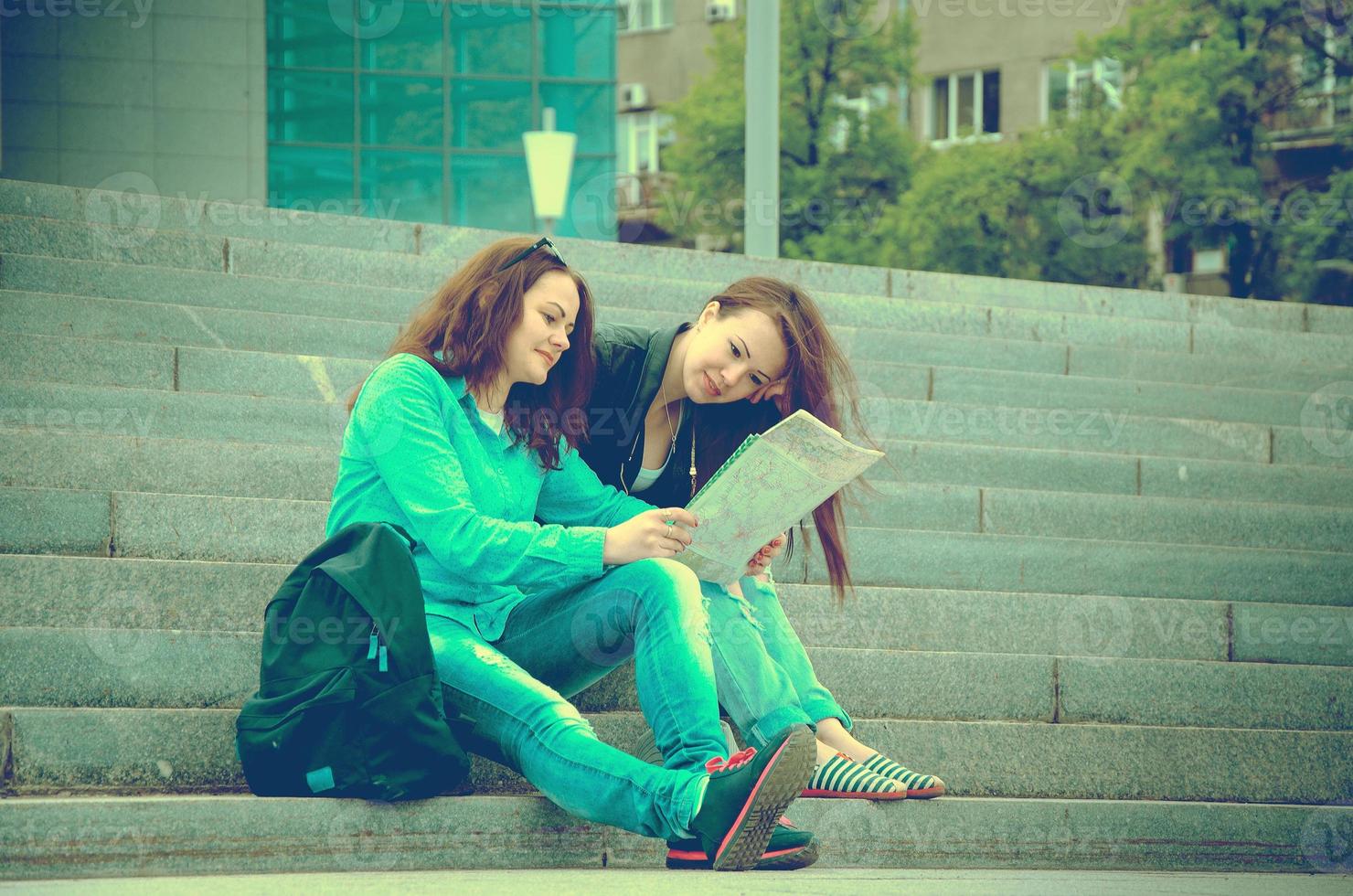 Two tourists resting on the steps photo