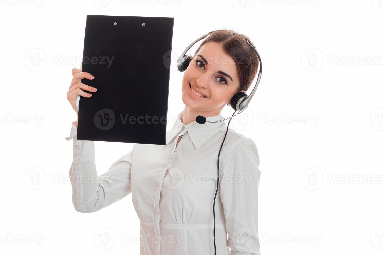 young cute business lady with headphone and microphone looking at the camera and smiling isolated on white background photo