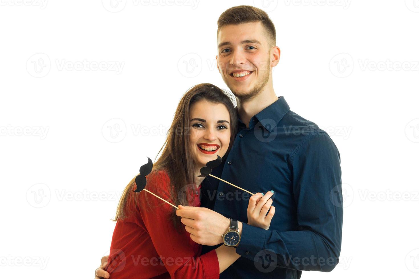 funny and wonderful guy with a girl holding paper Dummies laugh and stare into the camera close-up photo