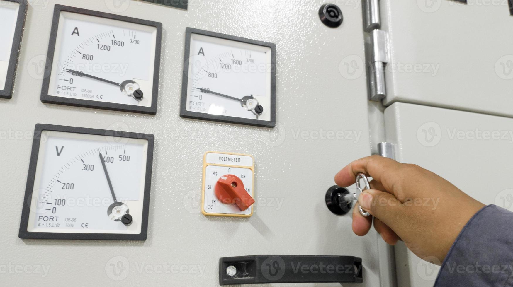The Hand man unlock door panel for checking and maintenance electrical system. photo