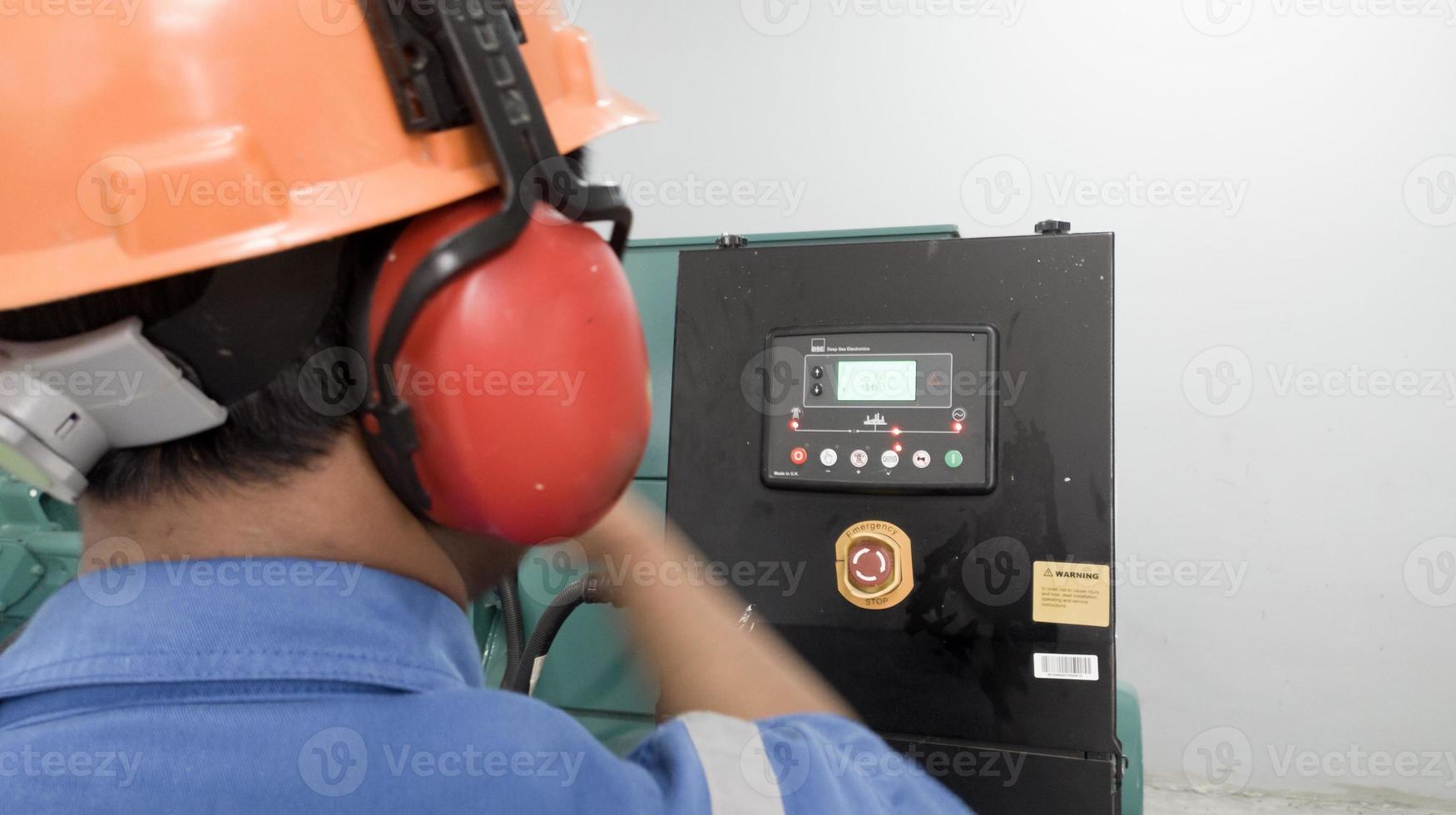 Pefessional engineering check and test perfomance the generator engine operarion. photo