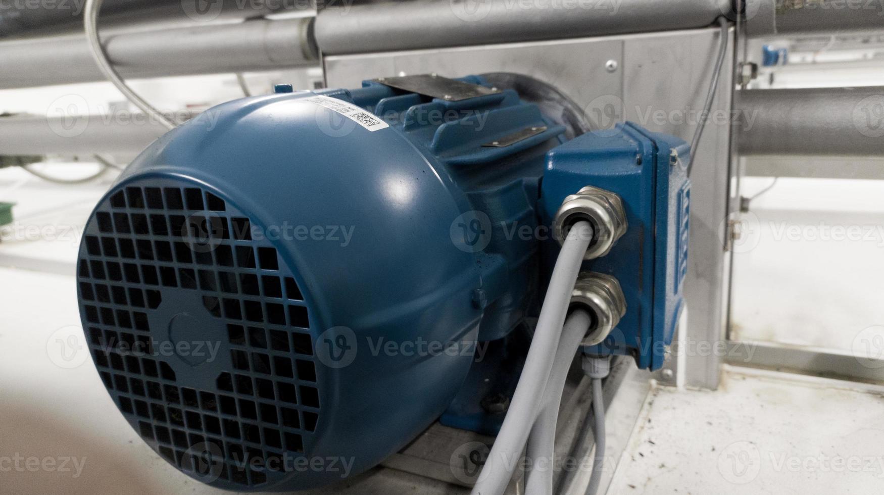 Induction motor instaled on incubation machine hatchery technology to moving  the fan. photo