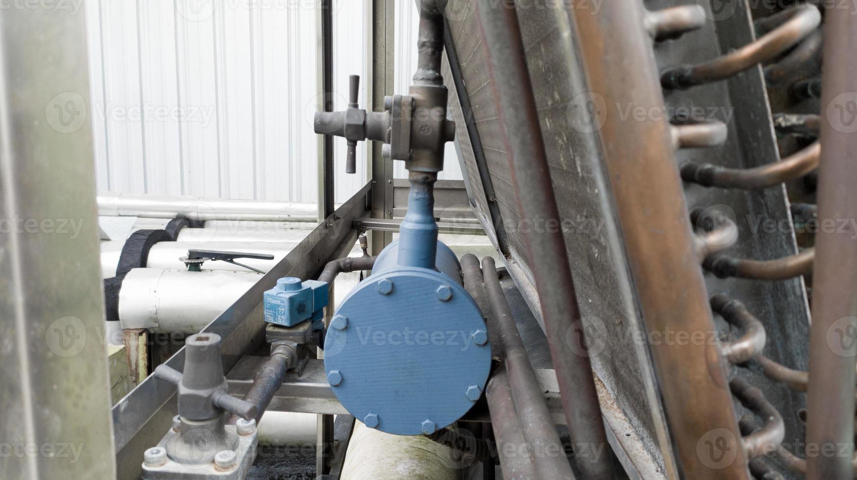 Refrigerant filter and piping condensor system in the chiller machine. photo