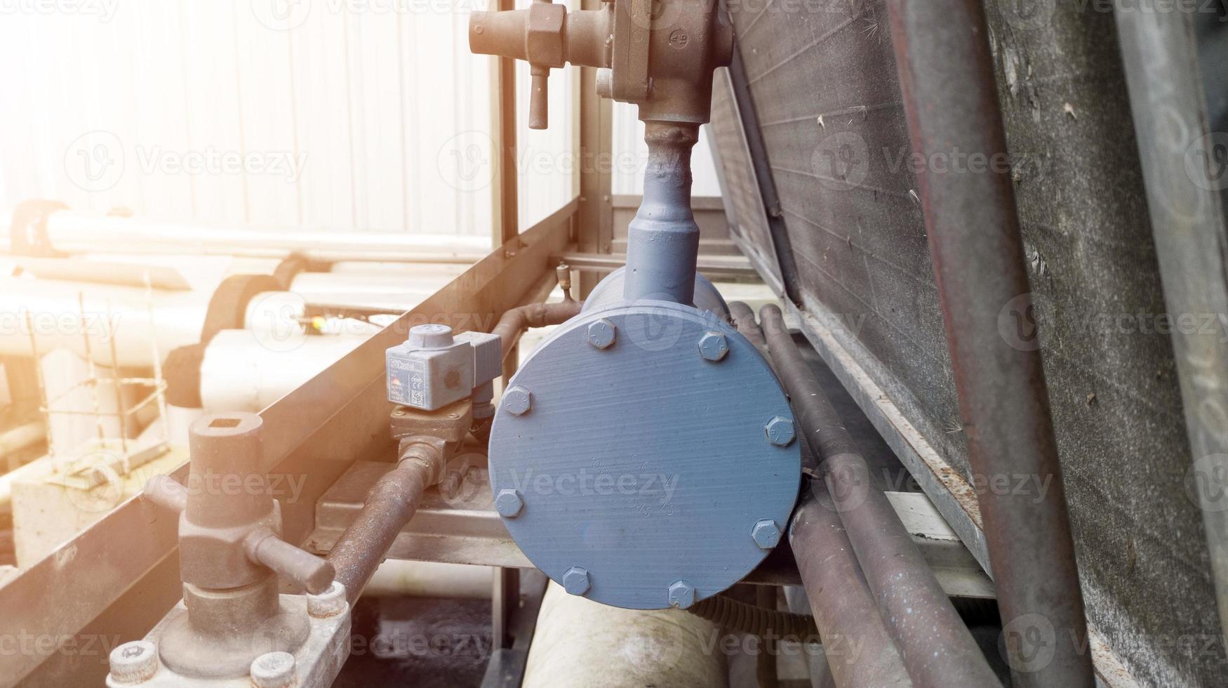 Refrigerant filter and piping condensor system in the chiller machine. photo