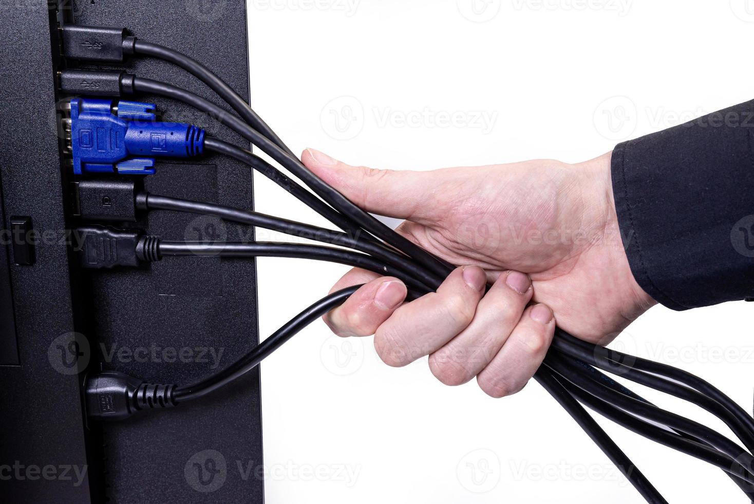 IT engineer Man hand inserts cable into monitor. Man hand connecting the DVI cable for monitor to computer PC. VGA DVI DisplayPort and power cable. close up in the hands of an . isolated photo