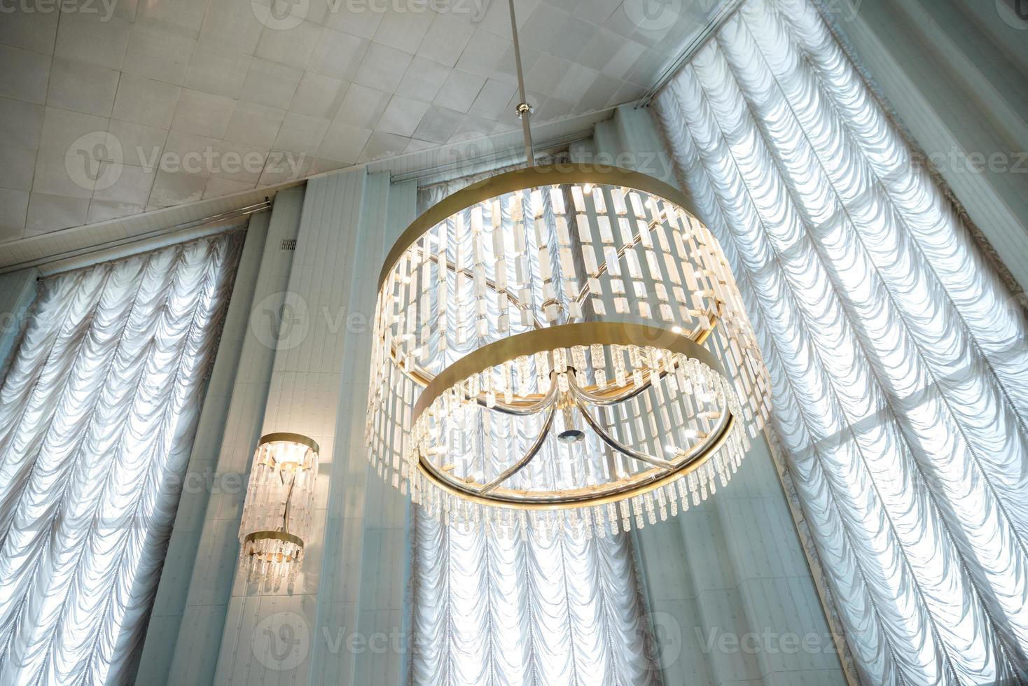 Chandelier in the registry office , hall or room with mosaics on the floor and beautiful lamps or chandeliers in the registry photo