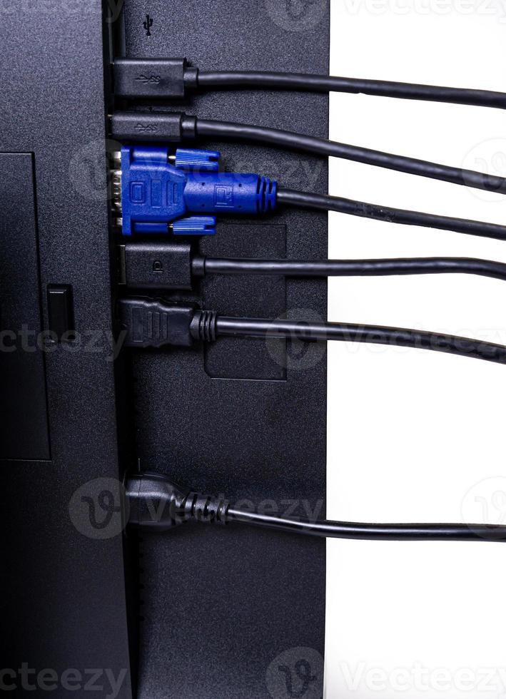 IT engineer Man hand inserts cable into monitor. Man hand connecting the DVI cable for monitor to computer PC. VGA DVI DisplayPort and power cable. close up in the hands of an . isolated photo