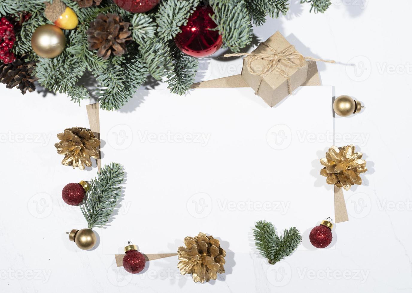 Mockup for a letter or a Christmas invitation with gold fir cone photo