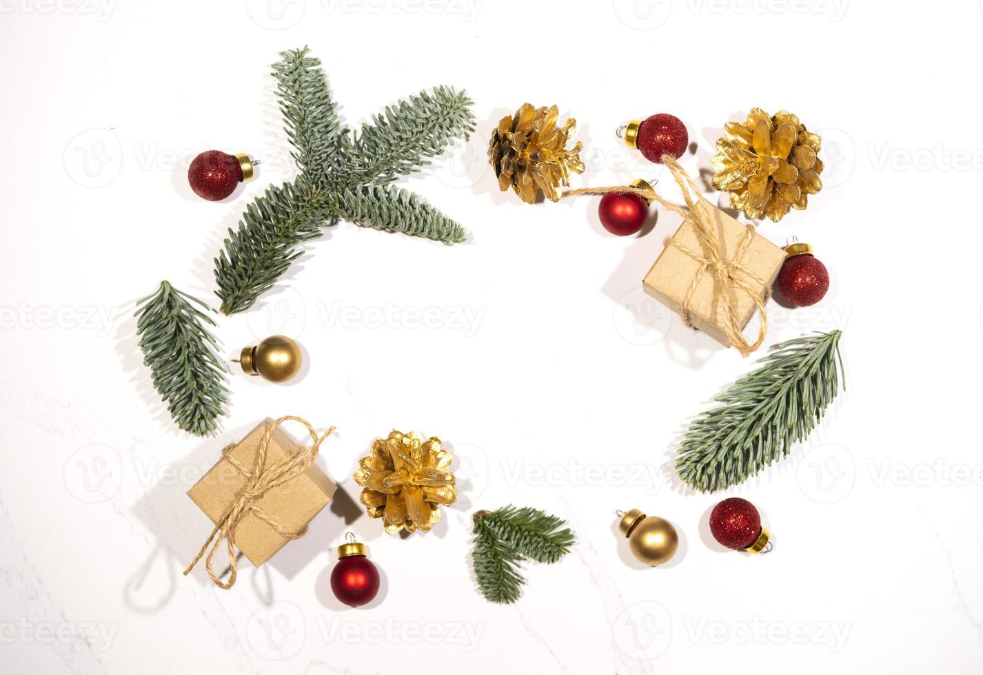Mockup for a letter or a Christmas invitation with gold fir cone photo