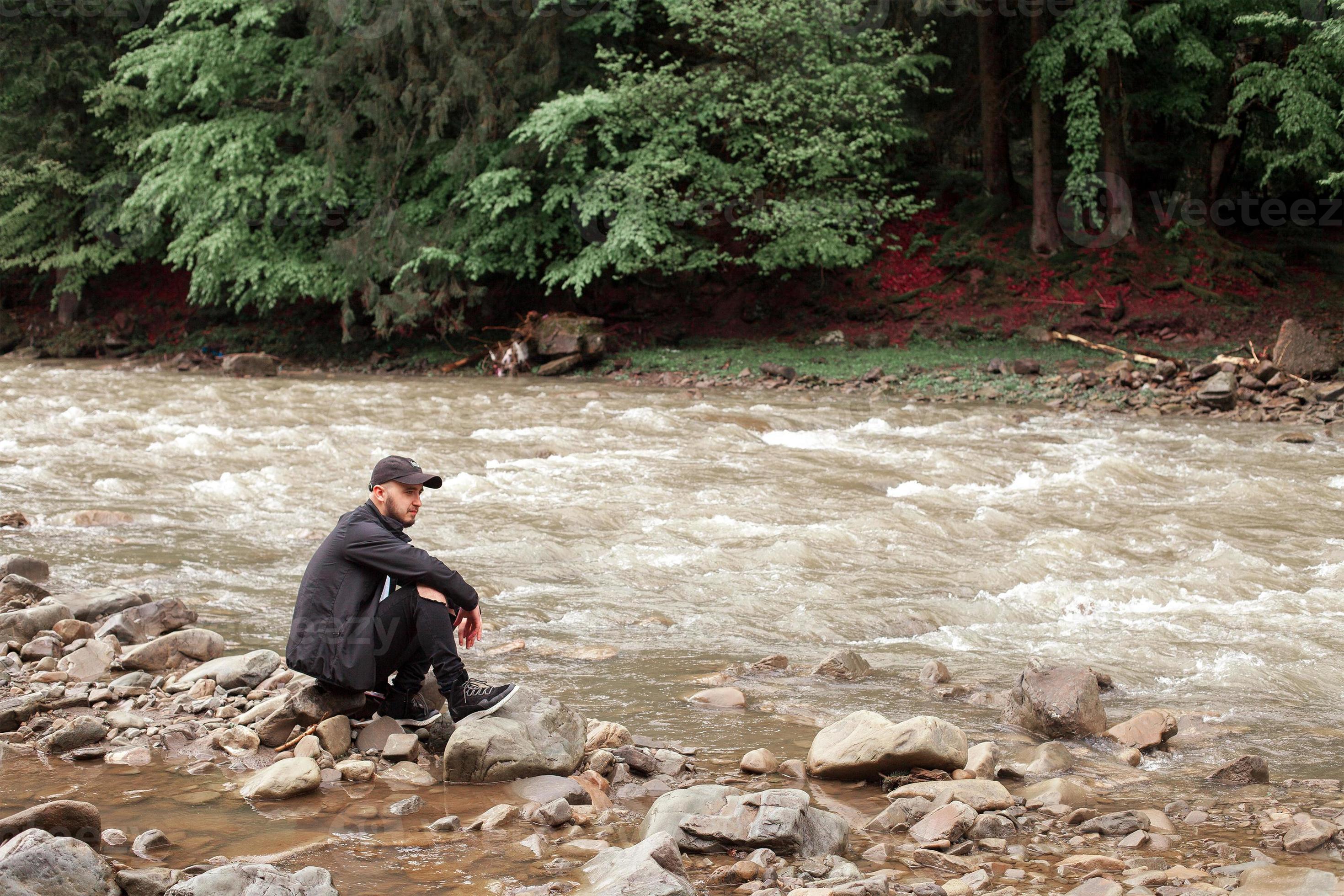 Man Sitting On Rocks Of Rough River 16092401 Stock Photo At Vecteezy man-sitting-on-rocks-of-rough-river-16092401-stock-photo-at-vecteezy