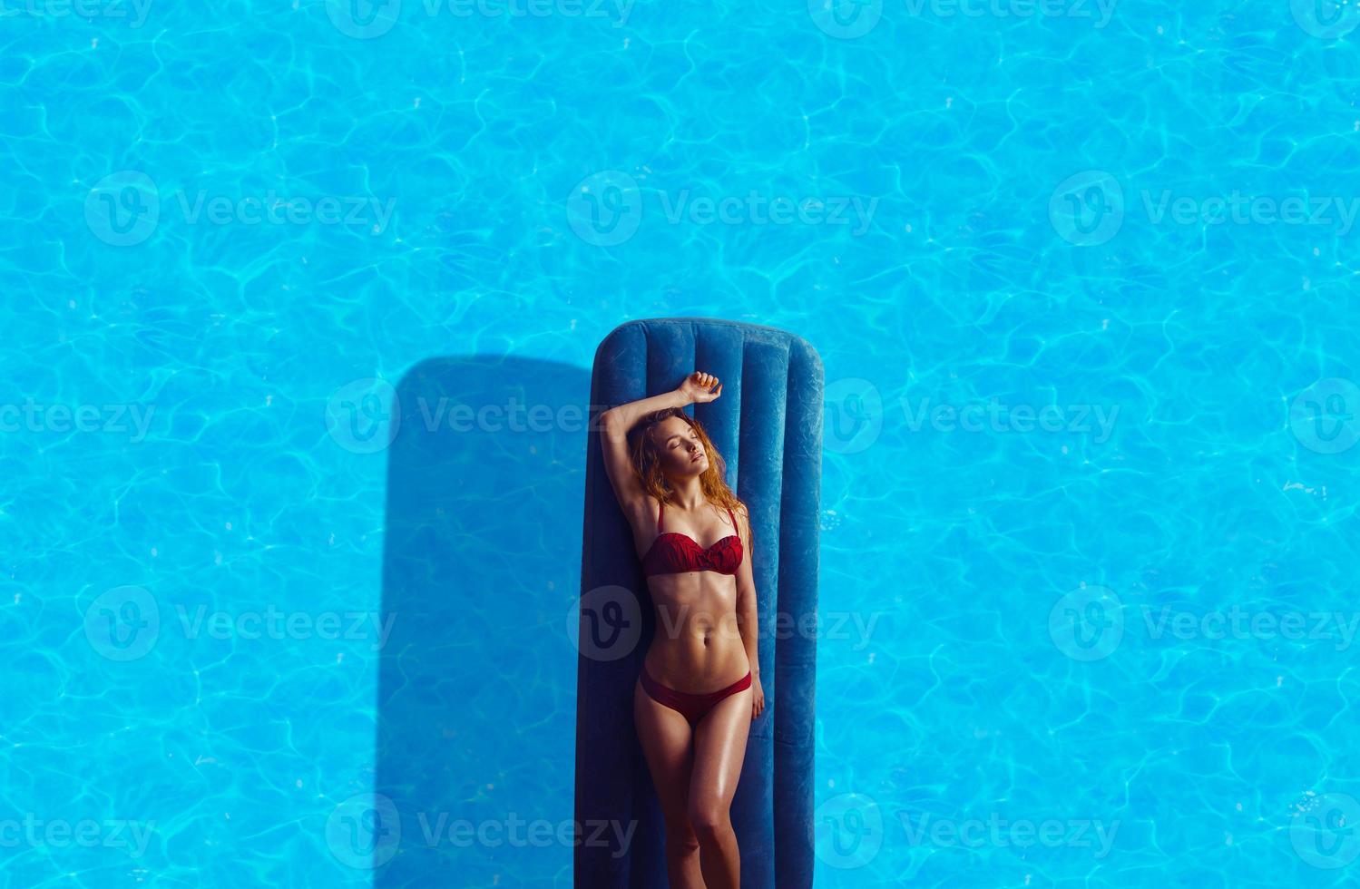 young beautiful lady in red bikini photo
