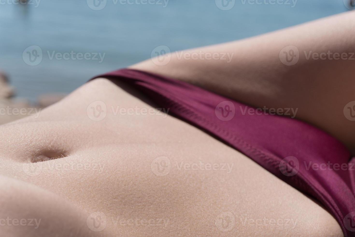 Close up view of stomach. Beautiful woman with slim body in underwear is in  the studio 15301718 Stock Photo at Vecteezy