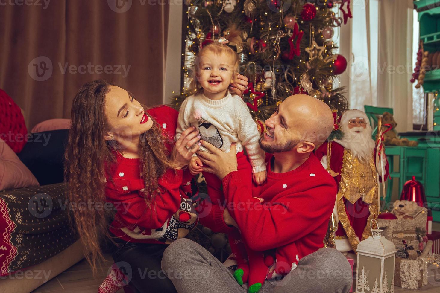 Happy family with daughter celebrate Christmas and New year together photo