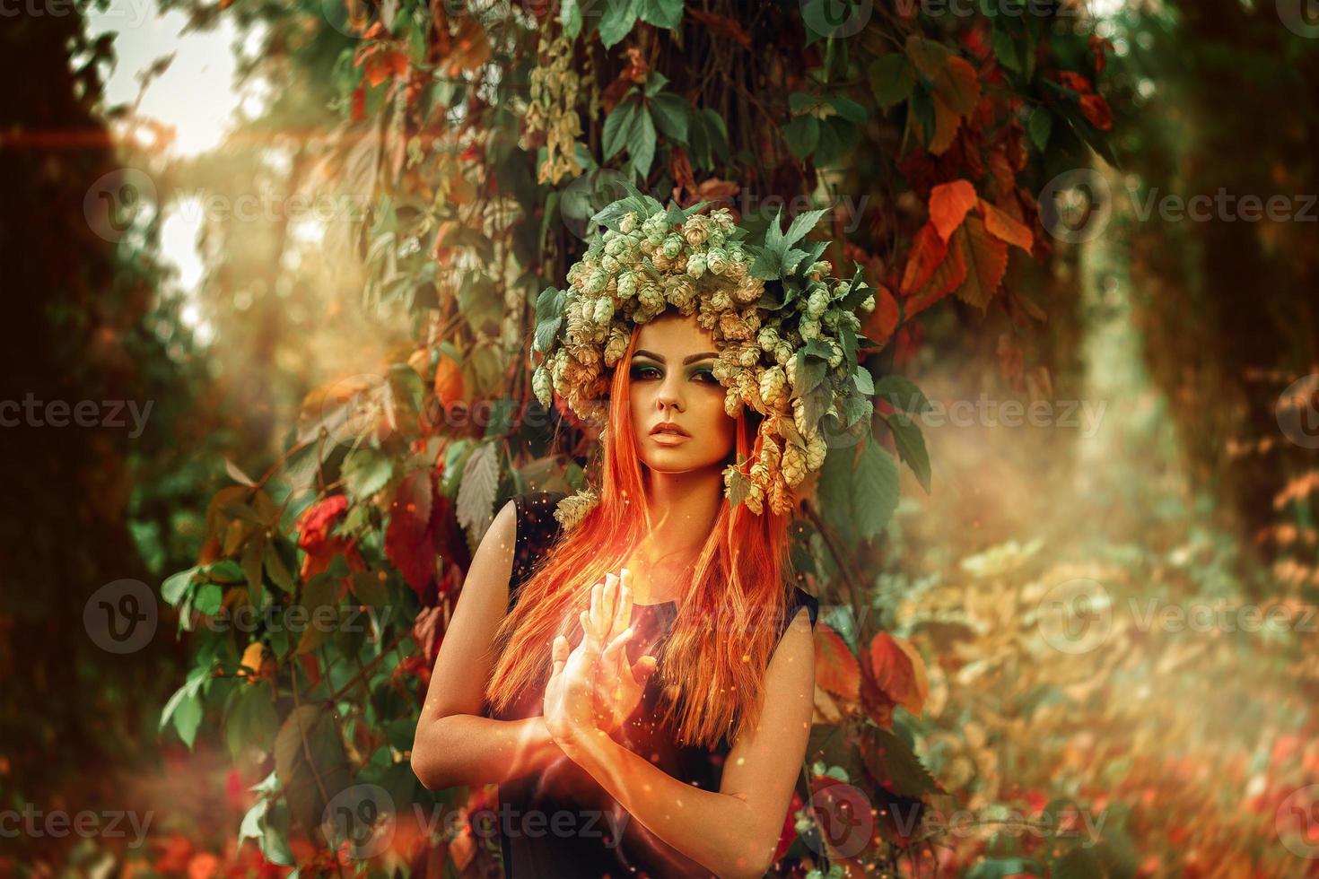 horizontal picture of amazing young witch conjures in the woods photo
