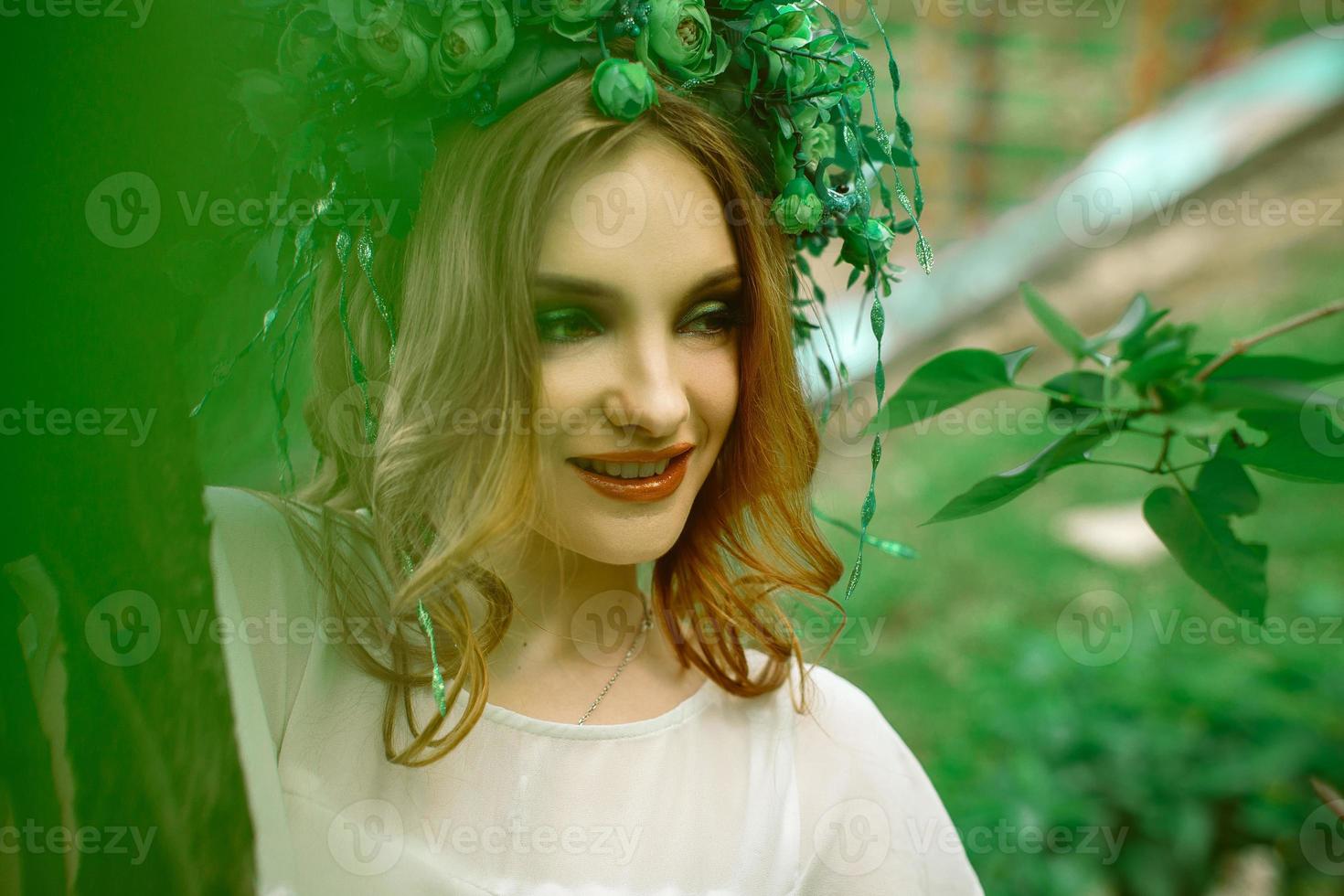 happy stylish young girl with wreath on head photo