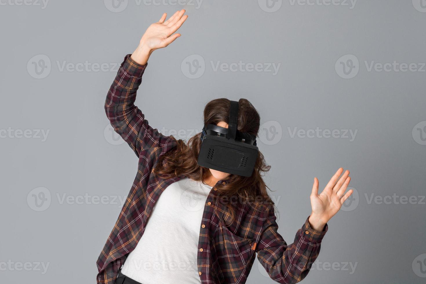 young beauty woman in virtual reality helmet photo