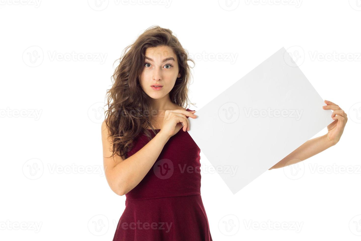 girl in red dress with white placard photo