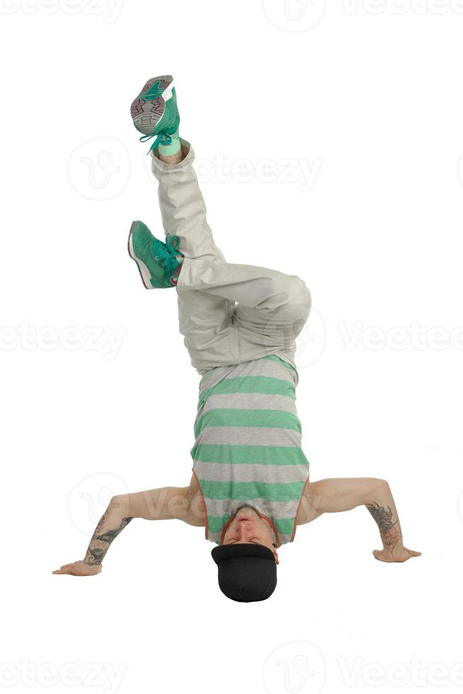 man in casual clothes standing on his head photo