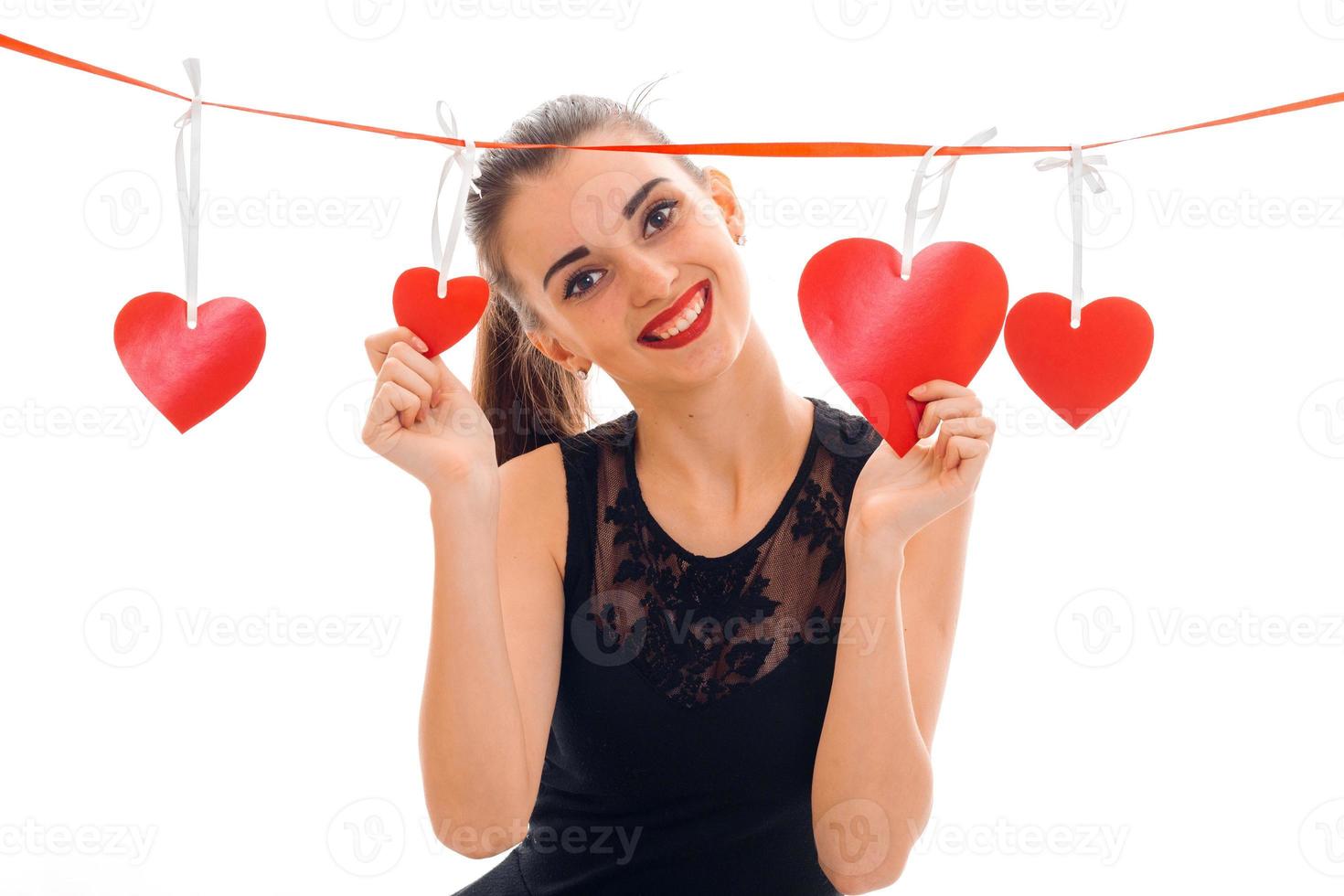 sweet stylish brunette lady celebrate saint valentines day with red heart isolated on white background photo