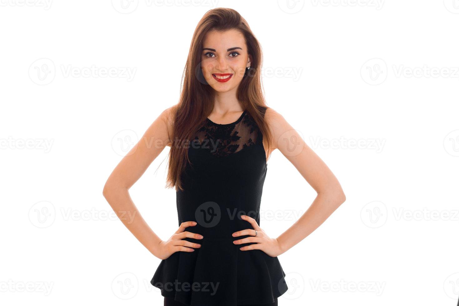 beauty young woman with red lips in black dress looking and smiling on camera isolated on white background photo