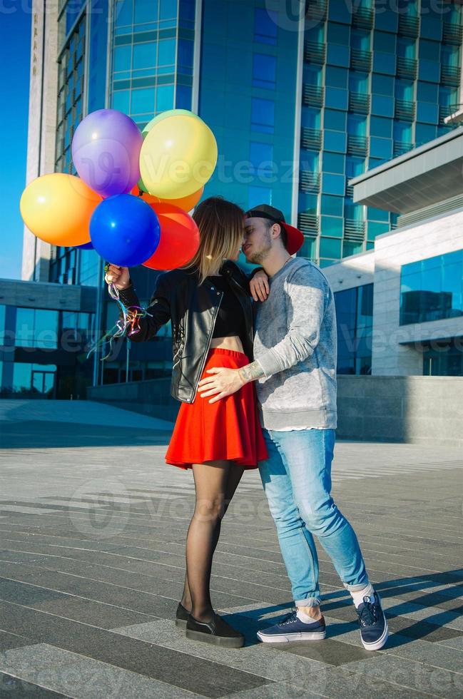 young couple outdoors hugging photo